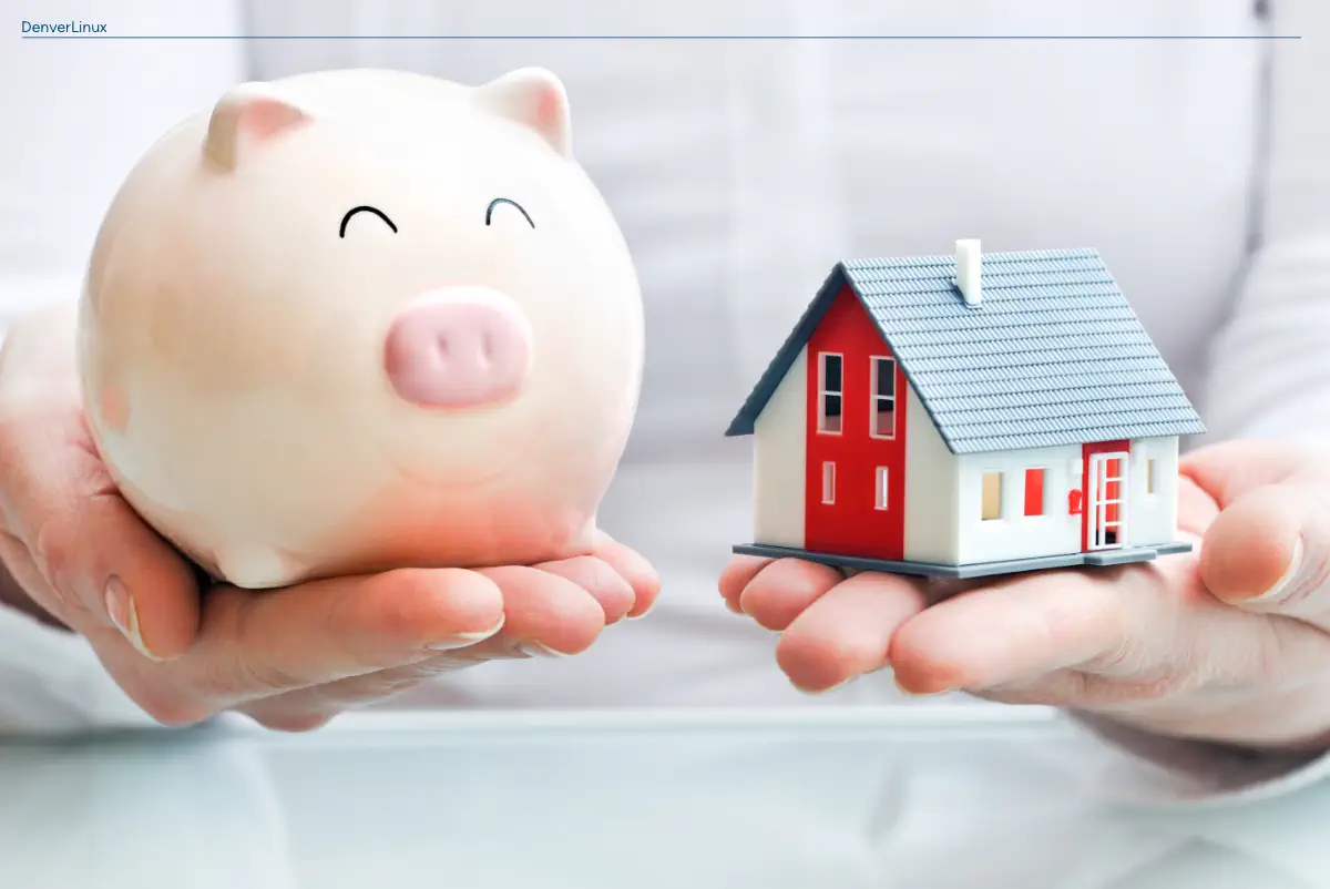 A photo of a piggy bank and a model of a home implying ways to save money as a homeowner